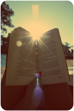 open book with sun