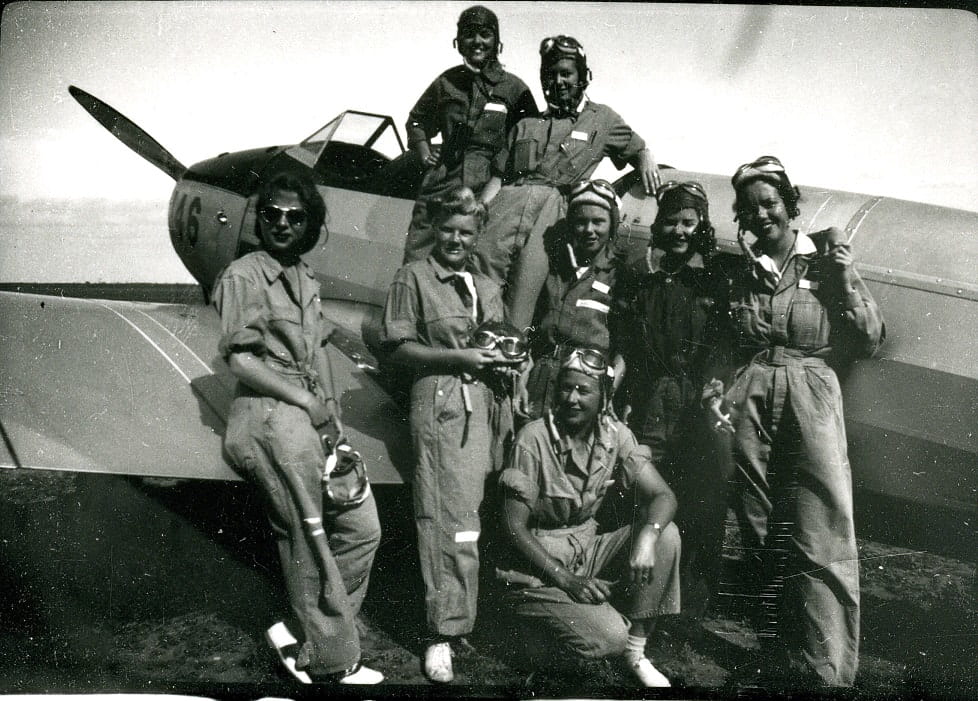 WASPs with PT-19, the first plane usually flown in primary training. Women on far left in dark glasses is Gertrude “Tommy” Tompkins, according to Texas Women’s University Libraries WASP Archives.